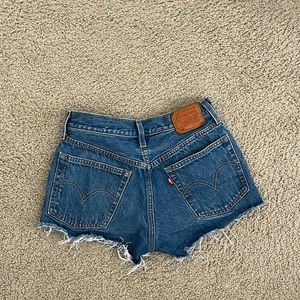 Levi’s 501 shorts, medium wash, size 25.
